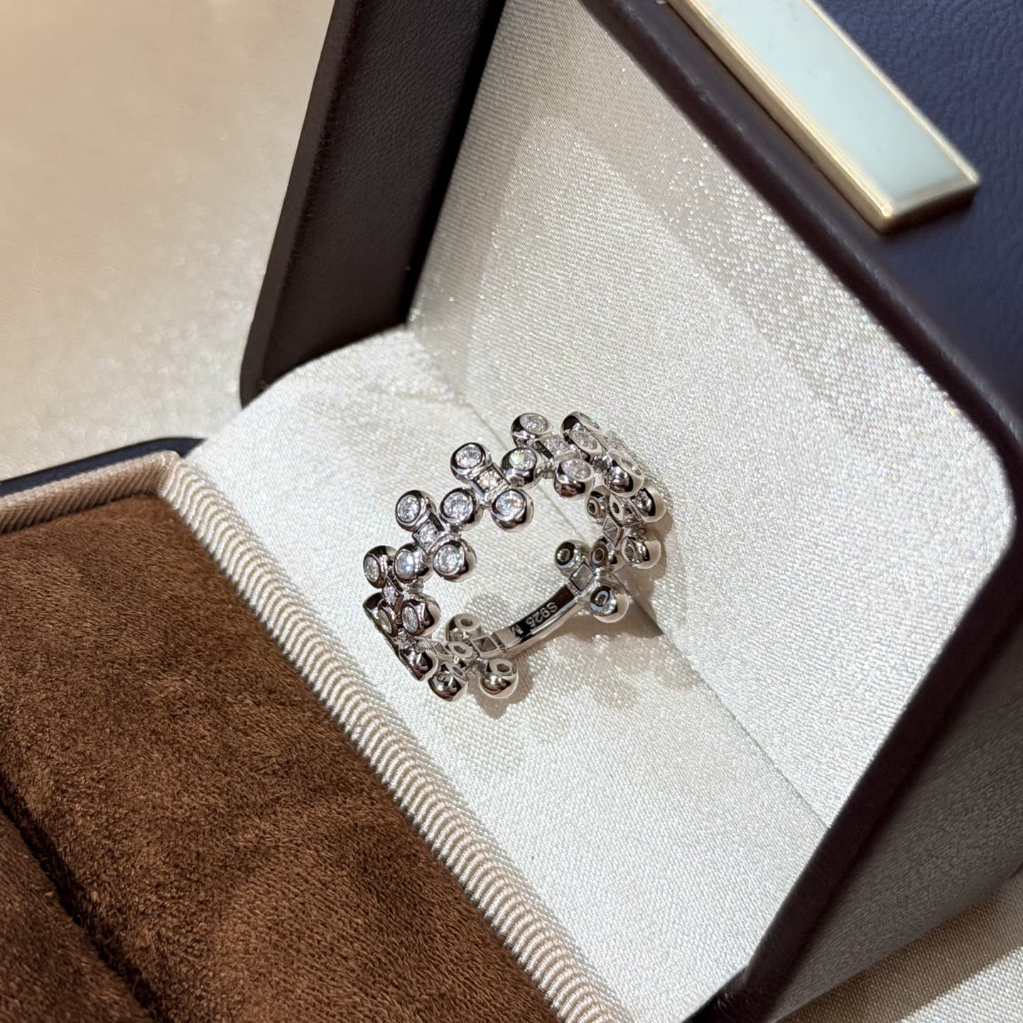 Van Cleef & Arpels Elegant Silver Ring with Cubic Zirconia Stones